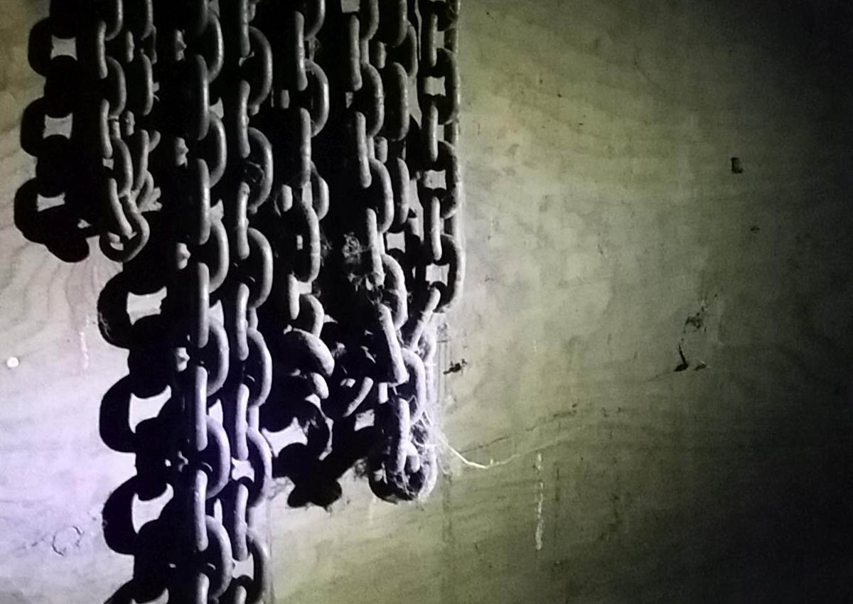 Chains hanging on wall